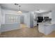 Bright open-concept kitchen featuring a breakfast bar and tile flooring throughout the house at 3122 W Dunbar Dr, Phoenix, AZ 85041