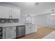 Bright kitchen offers quartz countertops, stainless steel appliances, a seamless flow into the living space at 3122 W Dunbar Dr, Phoenix, AZ 85041
