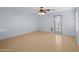 Well lit living room with a ceiling fan and outdoor access at 3122 W Dunbar Dr, Phoenix, AZ 85041