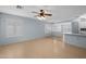 Bright living room with a ceiling fan and light wood-look floors at 3122 W Dunbar Dr, Phoenix, AZ 85041