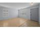 Bright living room featuring a hardwood floor, shuttered windows, and neutral paint at 3122 W Dunbar Dr, Phoenix, AZ 85041