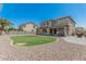 Expansive backyard with a well-maintained lawn and patio, great for outdoor living at 3528 E Tonto Dr, Gilbert, AZ 85298