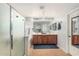 Primary bathroom featuring double sinks, and a walk-in shower at 3528 E Tonto Dr, Gilbert, AZ 85298