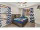 This is a bedroom with carpet and two windows with curtains and wooden blinds at 3528 E Tonto Dr, Gilbert, AZ 85298