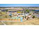 Aerial view of a colorful community park with various playgrounds, picnic areas, and parking at 3528 E Tonto Dr, Gilbert, AZ 85298