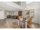 Open concept dining area with rustic table set and living room in background at 3528 E Tonto Dr, Gilbert, AZ 85298