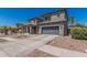 Beautiful two-story home featuring a front porch and desert landscaping for easy maintenance at 3528 E Tonto Dr, Gilbert, AZ 85298