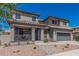 Charming two-story home with a cozy front porch and desert landscaping at 3528 E Tonto Dr, Gilbert, AZ 85298