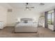 Large primary bedroom with a ceiling fan, and plenty of natural light at 3528 E Tonto Dr, Gilbert, AZ 85298