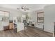 Home office featuring wood-style flooring, windows with blinds, and office furniture at 3528 E Tonto Dr, Gilbert, AZ 85298