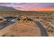 Expansive desert property featuring a modern home, long driveway and mountain views at 35280 N Bell Rd, Queen Creek, AZ 85144
