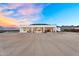 Modern home exterior with a covered patio, offering a serene outdoor living experience with mountain views at 35280 N Bell Rd, Queen Creek, AZ 85144