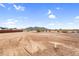 Expansive backyard with desert landscape and mountain views offering ample space for outdoor activities at 35280 N Bell Rd, Queen Creek, AZ 85144