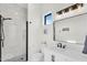 Stylish bathroom with a glass-enclosed shower, single sink vanity, and modern fixtures at 35280 N Bell Rd, Queen Creek, AZ 85144