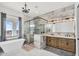 Luxurious bathroom showcasing a freestanding tub, glass shower, and wooden double sink vanity with desert views at 35280 N Bell Rd, Queen Creek, AZ 85144