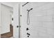 Close up of the tiled shower with matte black shower head and fixtures in bright updated bathroom at 35280 N Bell Rd, Queen Creek, AZ 85144