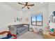 Charming bedroom with a built-in toddler bed with bright decor and large window at 35280 N Bell Rd, Queen Creek, AZ 85144