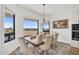 Cozy dining room with six chairs and a large window overlooking the serene landscape at 35280 N Bell Rd, Queen Creek, AZ 85144