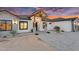 Welcoming entryway features stone pillars, modern lighting and well-maintained landscaping at 35280 N Bell Rd, Queen Creek, AZ 85144
