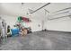 Spacious three car garage with epoxy floors, organized storage, and room for multiple vehicles at 35280 N Bell Rd, Queen Creek, AZ 85144