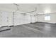 Spacious garage with epoxy floors, insulated doors, and plenty of room for multiple vehicles at 35280 N Bell Rd, Queen Creek, AZ 85144