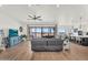Open-concept living room seamlessly connects to the kitchen, offering a cohesive living space with comfortable seating at 35280 N Bell Rd, Queen Creek, AZ 85144
