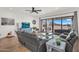 Relaxing living room with a large sliding door offering scenic desert views and comfortable seating at 35280 N Bell Rd, Queen Creek, AZ 85144