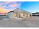 Modern home with a covered patio offering an ideal setting for outdoor relaxation and entertainment at 35280 N Bell Rd, Queen Creek, AZ 85144