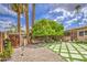 Lush backyard featuring a well-manicured lawn and mature trees at 3954 E Becker Ln, Phoenix, AZ 85028