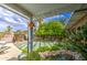 Serene backyard oasis featuring a tranquil pond and lush landscaping at 3954 E Becker Ln, Phoenix, AZ 85028