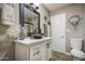 Elegant bathroom showcasing a granite countertop vanity and modern fixtures at 3954 E Becker Ln, Phoenix, AZ 85028