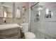 Bathroom features modern vanity, glass shower, white tile, and seahorse wall decor at 3954 E Becker Ln, Phoenix, AZ 85028