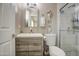 Updated bathroom with modern vanity, glass-enclosed shower, and stylish fixtures at 3954 E Becker Ln, Phoenix, AZ 85028