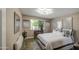Serene bedroom with natural light, stylish decor, and a comfortable bed at 3954 E Becker Ln, Phoenix, AZ 85028