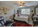 Comfortable bedroom featuring warm lighting, stylish decor, and a plush leather recliner at 3954 E Becker Ln, Phoenix, AZ 85028