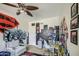 Unique bedroom with gray tile floors, a light gray sofa, unique wall art and city view at 3954 E Becker Ln, Phoenix, AZ 85028