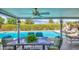 Relaxing covered patio overlooking a refreshing private pool and lush landscaping at 3954 E Becker Ln, Phoenix, AZ 85028
