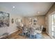 Bright dining room with a glass table, chandelier-style candleholders, and stylish modern decor at 3954 E Becker Ln, Phoenix, AZ 85028