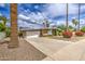 Well-maintained home with a two-car garage and mature landscaping and a view of the driveway at 3954 E Becker Ln, Phoenix, AZ 85028