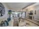 Cozy living room opens to the kitchen with generous seating, decor, and wood-look floors at 3954 E Becker Ln, Phoenix, AZ 85028