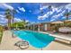 Enjoy the spacious pool with a diving board, patio area, and inviting lounge chairs at 3954 E Becker Ln, Phoenix, AZ 85028