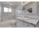 Elegant bathroom featuring marble countertops and a shower-tub combo at 4201 N 35Th St, Phoenix, AZ 85018