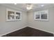 Comfortable bedroom with hardwood floors, shutters, and abundant natural light at 4201 N 35Th St, Phoenix, AZ 85018