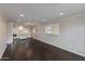 Open-concept living space with hardwood floors and modern lighting fixtures at 4201 N 35Th St, Phoenix, AZ 85018