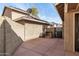 Enclosed backyard with tiled patio area offering privacy and outdoor enjoyment at 4212 W Jason Dr, Glendale, AZ 85308