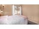 Bright bedroom featuring neutral walls, window with natural light, and comfortable bedding at 4212 W Jason Dr, Glendale, AZ 85308