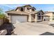 Charming two-story home featuring unique architectural details and a two-car garage at 4212 W Jason Dr, Glendale, AZ 85308