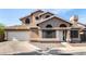 Charming two-story home featuring unique architectural details and a two-car garage at 4212 W Jason Dr, Glendale, AZ 85308