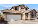 Charming two-story home featuring unique architectural details and a two-car garage at 4212 W Jason Dr, Glendale, AZ 85308