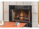 Traditional fireplace featuring a black trim and protective screen, providing warmth and a cozy ambiance at 4212 W Jason Dr, Glendale, AZ 85308